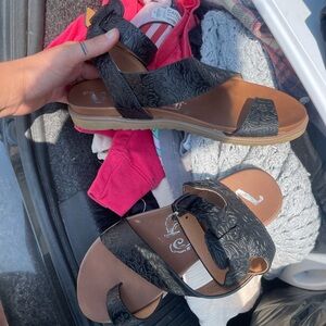 Brand new never worn black leather tooled strappy sandals